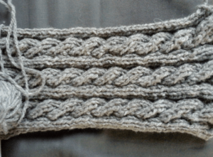 grey knitted homemade torsaded scarf, from natural wool with no dyeing