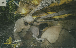 Checking a bedding shelter under hides in the forest