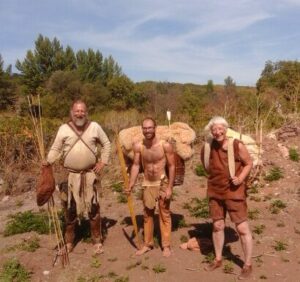 Three people ready for immersion in nature with primitive gear in Spain