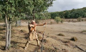 Shooting a primitive wooden bow in Spain